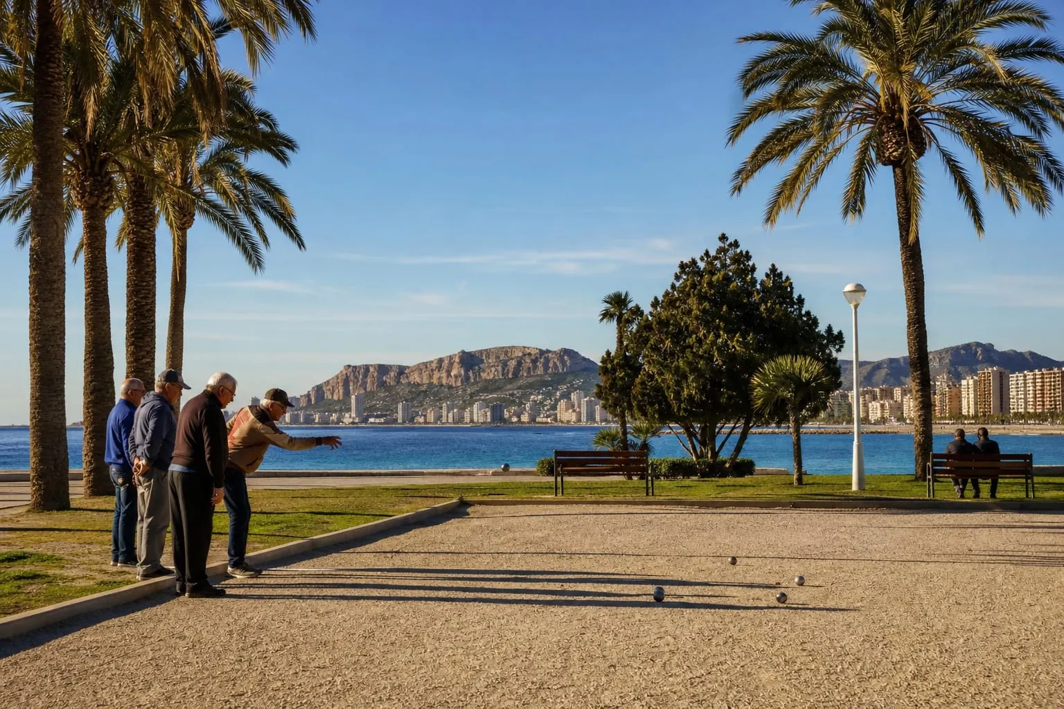 Retirees playing pétanque in a seaside park in Alicante